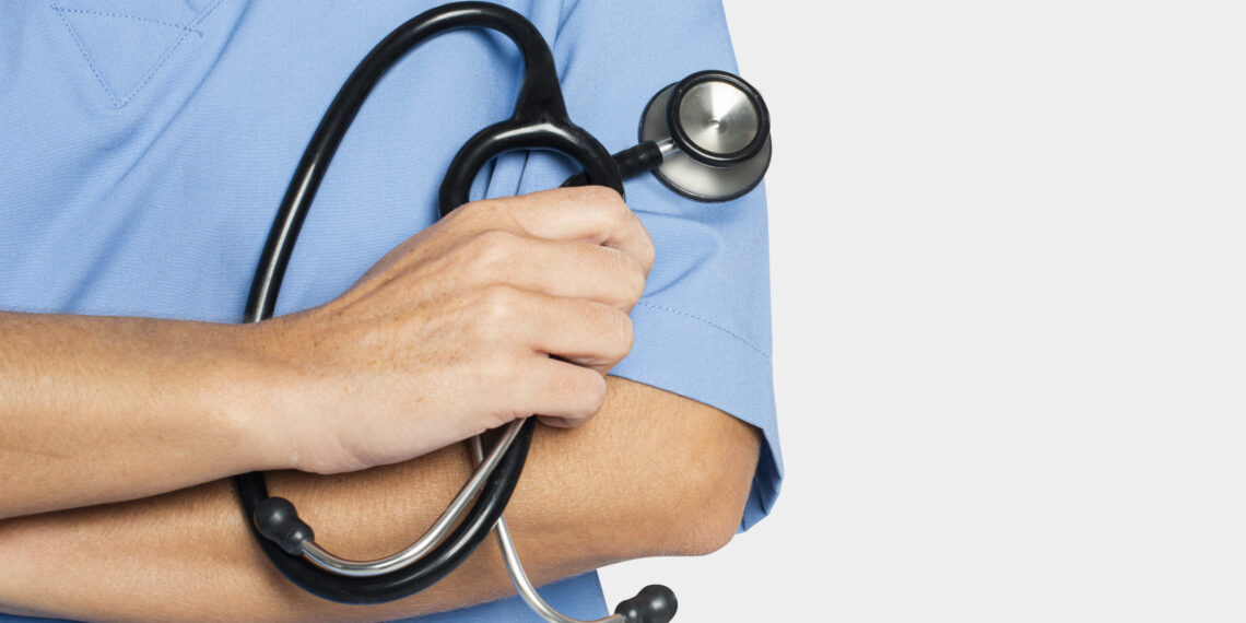 Doctor&rsquo;s hand holding a stethoscope closeup